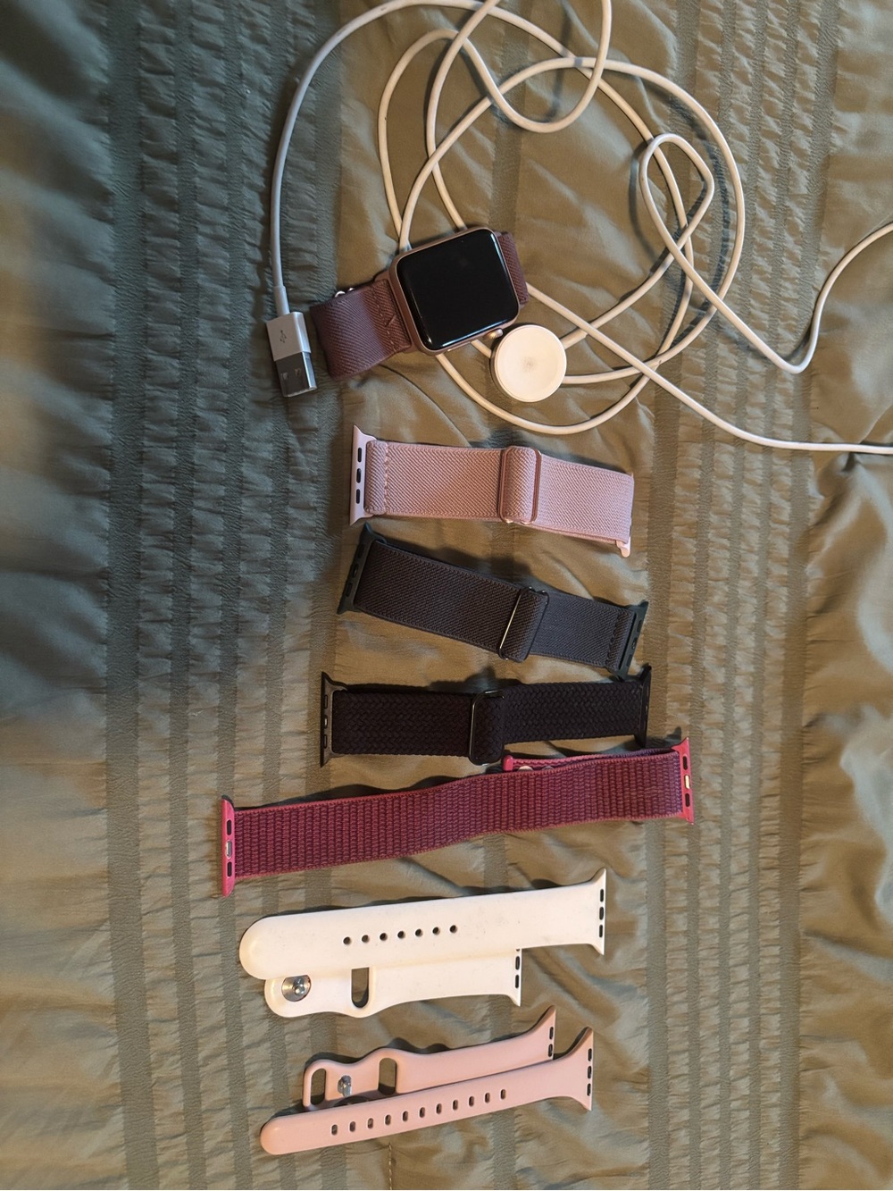Apple Smartwatch with Pink, Black, Burgundy and White Bands. SE.